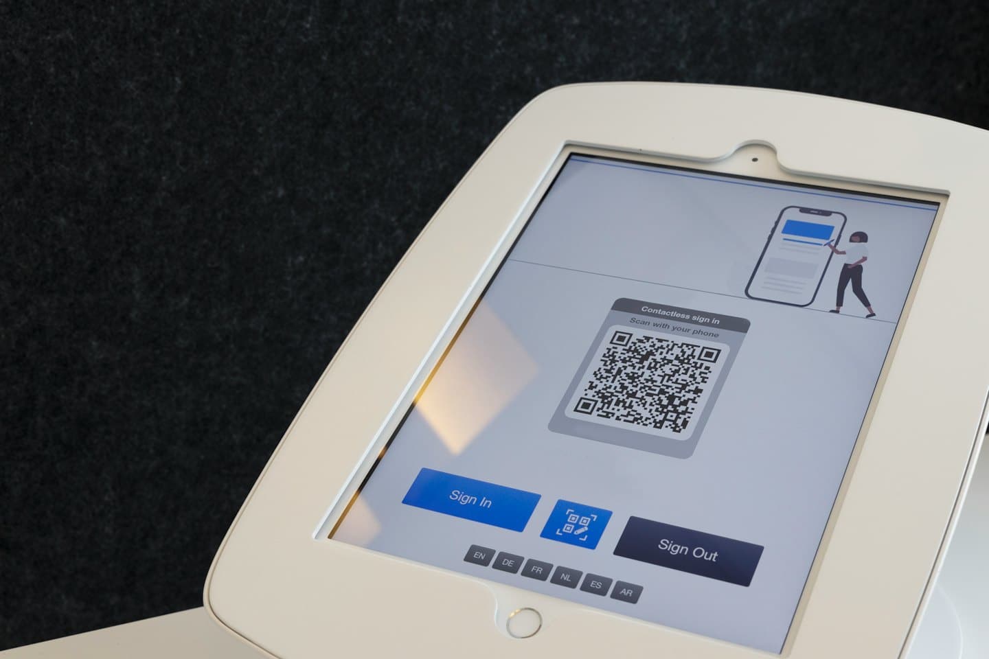 Tablet displaying QR code for contactless sign-in.